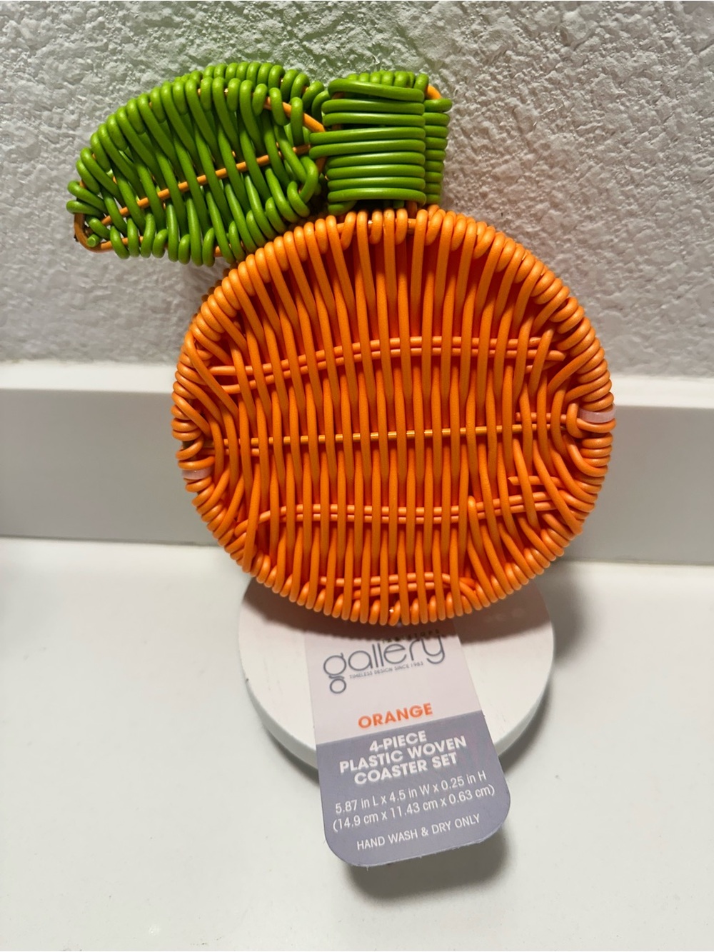 Gallery Orange Fruit-Shaped Woven Coaster with Green Leaf Accent
